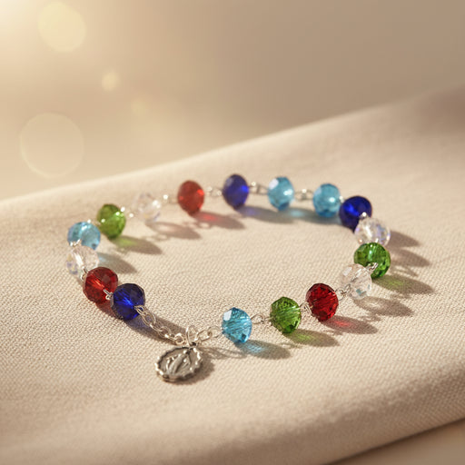 Colorful beaded bracelet on a wooden surface with a blurred indoor background