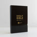 A black Holy Bible standing upright on a white surface against a white background, with gold lettering that reads 'HOLY BIBLE', 'NIV', and 'LARGER PRINT'.