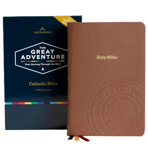 Brown Bible with embossed logo and 'The Great Adventure' packaging in the background