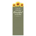 A tall, narrow decorative card or print with a sage green background, featuring three yellow sunflowers at the top and the quote 'HE HAS MADE EVERYTHING Beautiful in its time. ECCLESIASTES 3:11' in white text.