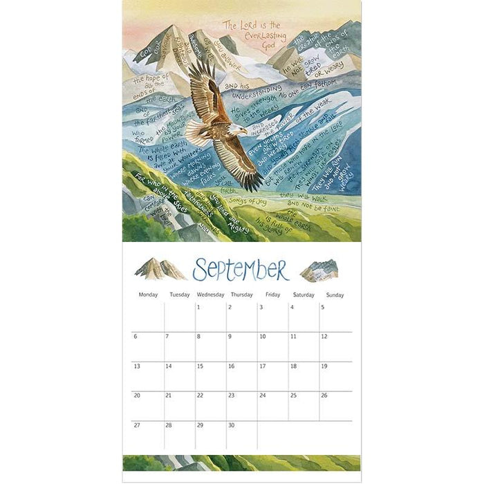 A vertical wall calendar page featuring a painted mountain landscape with an eagle flying over green hills and a September calendar grid below.