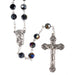 Rosary with black beads and silver cross on a white background
