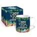 A white ceramic mug with a navy blue floral design and the text 'THE JOY OF THE LORD IS MY STRENGTH' stands in front of its matching product box on a white background.