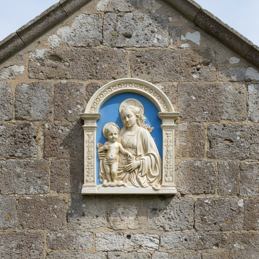 Decorative plaque with a classical design of a woman holding a child against a blue background