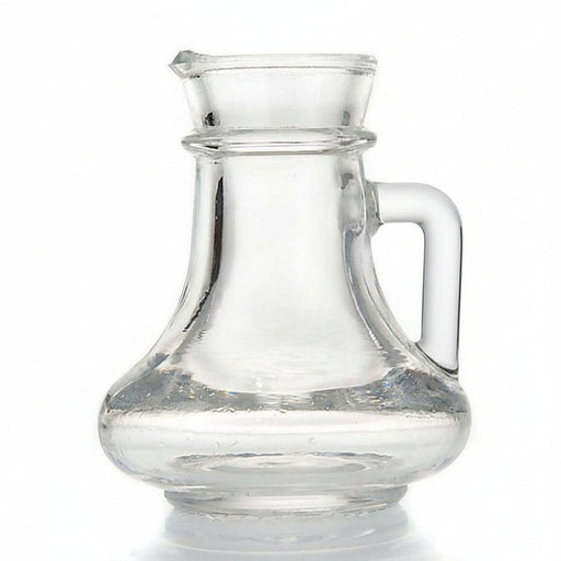 Clear glass pitcher with a curved handle and pouring spout, shown on a white background.