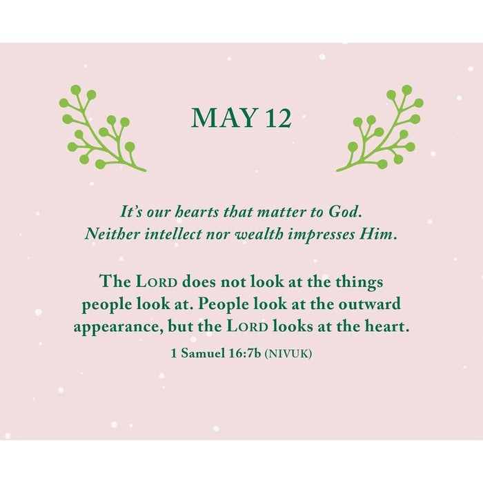 A square inspirational quote card with a pale pink background, green decorative leaf illustrations at the top corners, and the date MAY 12 centered above dark green text. The text reads: “It’s our hearts that matter to God.