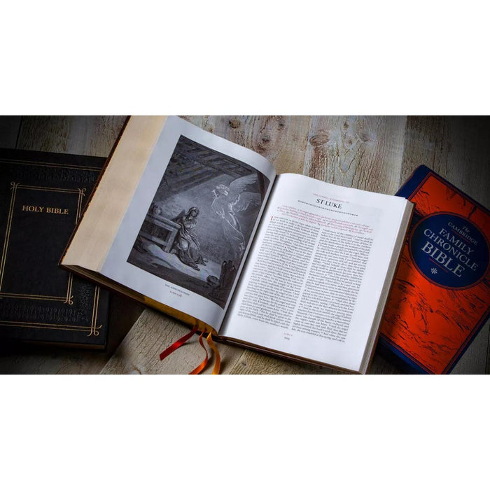 An open Holy Bible lies on a rustic wooden surface, flanked by a closed black Holy Bible on the left and a closed red/orange Family Bible on the right. The open Bible shows a black-and-white illustration on the left page and a text page on the right.