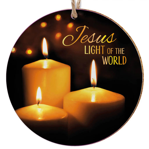 Round hanging ornament with a printed design of three lit candles on a dark background and the text 'Jesus LIGHT OF THE WORLD' in gold and white lettering.