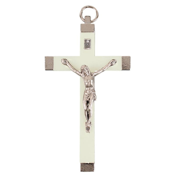 A metal luminous crucifix with a silver-colored Jesus Christ figure, predominantly gray and white in color, designed to glow in the dark.