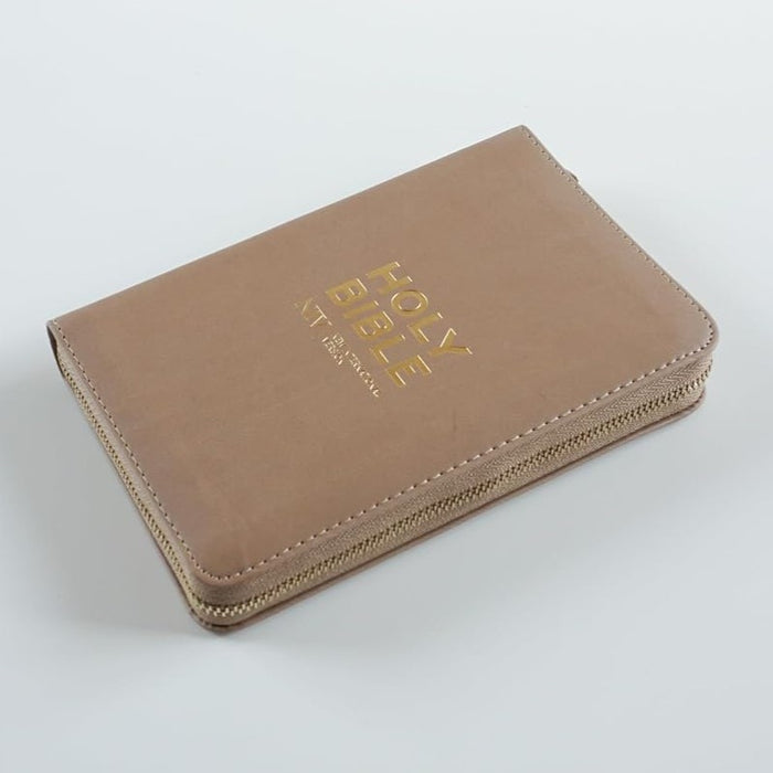 A tan leather Holy Bible zippered cover with gold foil lettering, shown on a light gray background.