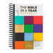 Notebook titled 'The Bible in a Year Notebook' with colorful square design on a white background