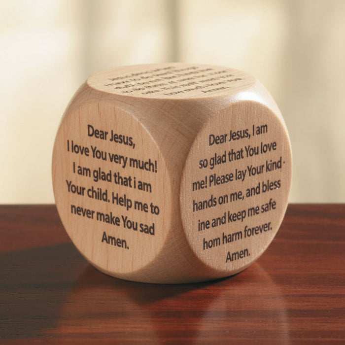 A multicolored wooden prayer cube with different prayers written on each of its six faces, placed on a wooden surface.